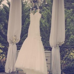 Beautiful wedding dress, size 13, great condition, comes with garment bag.